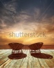 stock-photo-amazing-sunset-at-tropical-beach-ocean-landscape-with-chairs-for-relaxation-on-wooden-terrace-220040413