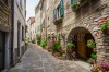 stock-photo-italy-june-typical-italian-street-in-a-small-provincial-town-of-tuscan-italy-europe-204035911