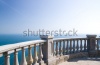 stock-photo-kind-on-ocean-from-a-stone-balcony-83884945