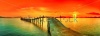 stock-photo-sunset-over-the-sea-pier-on-the-foreground-panorama-105983024