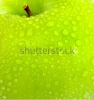stock-photo-apple-in-green-with-water-drops-on-its-surface-57965215