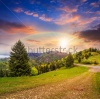 stock-photo-asphalt-road-following-the-rainbow-going-down-the-hill-and-up-into-mountains-passes-