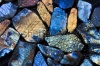 stock-photo-beautiful-texture-of-natural-wet-colorful-labradorite-gem-stones-144707182