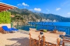 stock-photo-chairs-with-table-on-sunny-terrace-with-sea-view-on-kefalonia-island-near-assos-village-greece-224222548