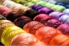 stock-photo-different-color-threads-on-rows-in-the-store-73219969