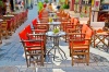 stock-photo-empty-tables-in-greek-coffee-shop-on-the-street-ioannina-epirus-greece-191762348
