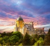 stock-photo-fairy-palace-against-sunset-sky-panorama-of-pena-national-palace-in-sintra-portugal-europe-144418426