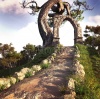 stock-photo-fantasy-scenery-with-road-tree-and-stone-arc-on-top-of-the-hill-224420713