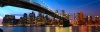 stock-photo-lower-manhattan-skyline-panorama-with-brooklyn-bridge-at-sunset-in-new-york-city-136521776