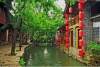 stock-photo-photo-of-beautiful-street-in-lijiang-china-with-a-canal-old-houses-trees-and-red-lantern