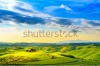 stock-photo-tuscany-rural-sunset-landscape-countryside-farm-cypresses-trees-green-field-sun-light-and-22287