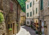 stock-photo-typical-italian-street-in-a-small-provincial-town-of-tuscan-italy-europe-242019406